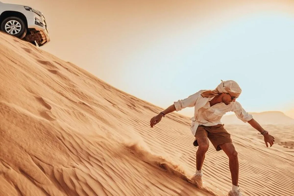 Image 1 of Deluxe Sunset Desert Safari: SandSurfing, Camel Ride & BBQ dinner