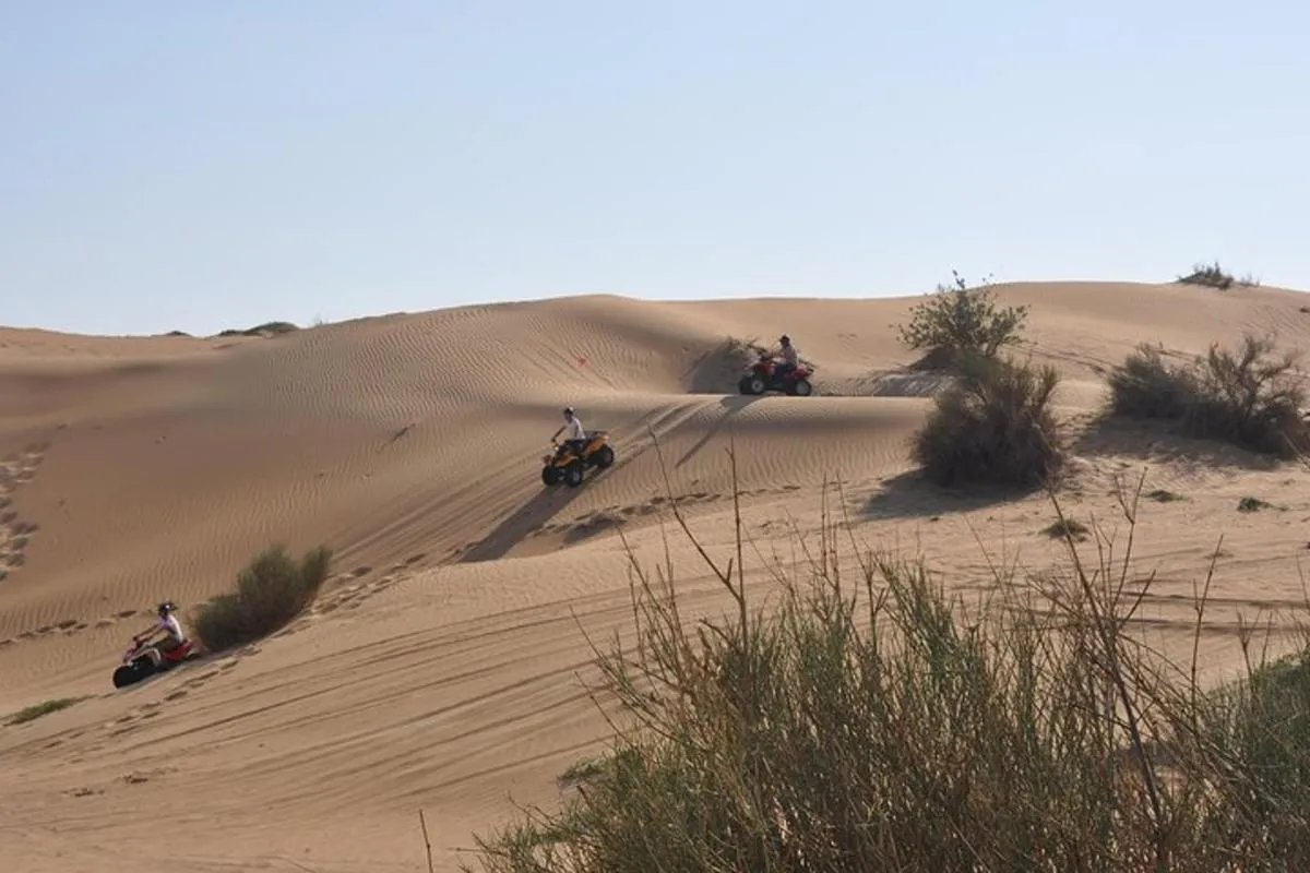Image 0 of Dubai Desert Afternoon Quad Safari with Camel Ride, BBQ Dinner and Belly Dancing