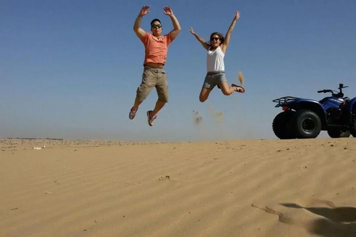 Image 0 of Dubai Desert Morning Tour in 4WD Vehicle: Camel Ride, Quad Bike Tour, Sandboarding, and Camel Farm