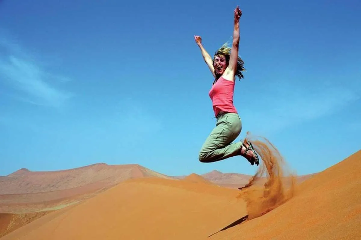Image 2 of Dubai Desert Safari with BBQ Dinner, Sandboarding, Camels & Shows