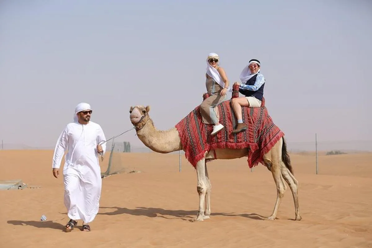 Image 2 of Dubai Desert Safari with Quad Bike, Dune Bashing, Camel Ride, Sand Boarding &BBQ