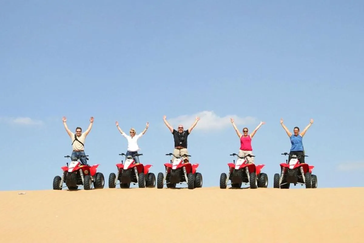 Image 0 of Dubai Red Dunes Safari by Quad Bike, Sand boarding, Camel Ride & BBQ Dinner