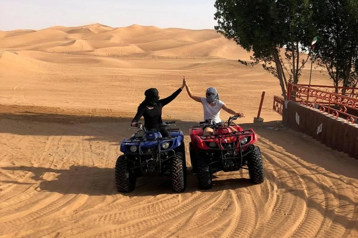 Image 0 of Dubai: Unique SUNSET Quad Bike Red Dunes Safari