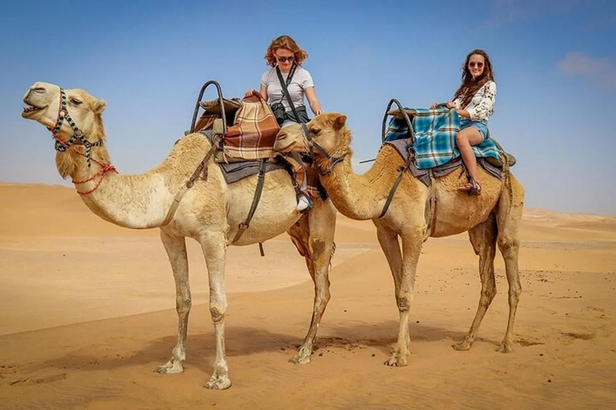 Image 1 of Exclusive Morning Desert Adventure: Sandboarding & Camel Ride