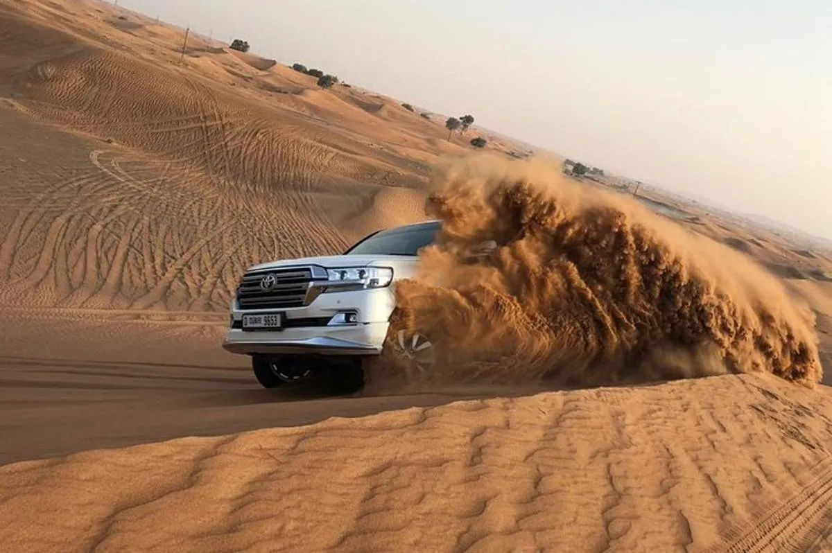 Image 0 of Red Dunes Adventure: Sandboarding, Camel Ride,BBQ & Entertainment
