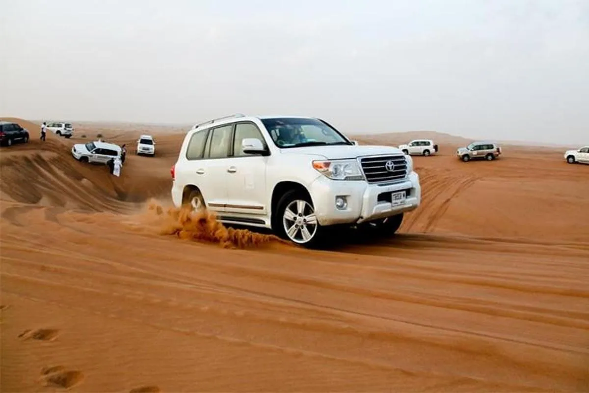Image 0 of Sunset Desert Safari with BBQ, Camel Ride & Sandboarding