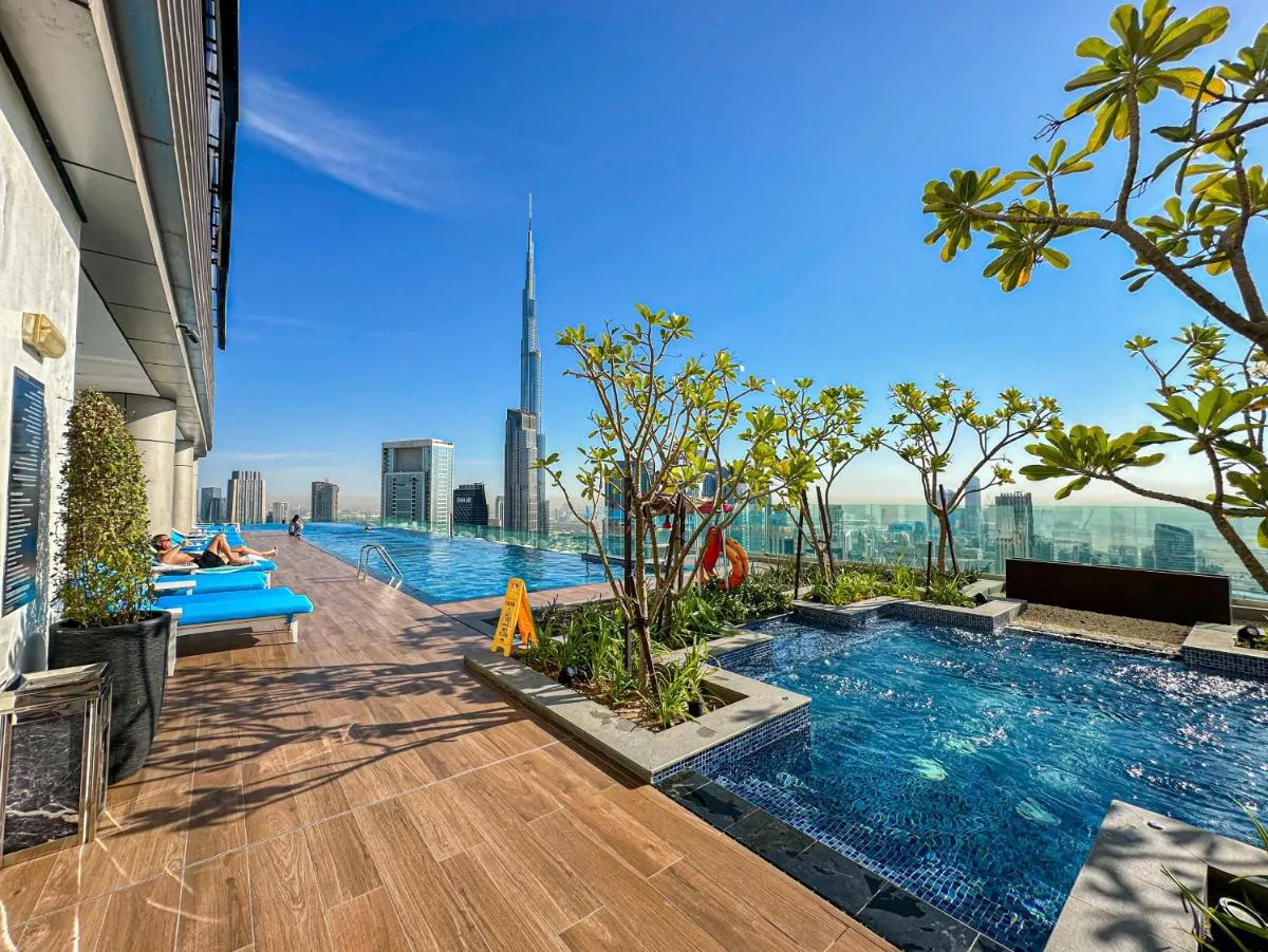 64th floor rooftop pool offering amazing Burj Khalifa views, 2BR apartment in Paramount Hotel Midtown - 3