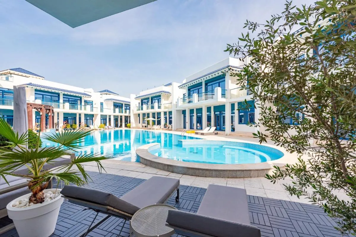 Stunning Palm Villa with Rooftop Garden, Resort Style Pool and Beach by Exclusive Holiday Homes - 3