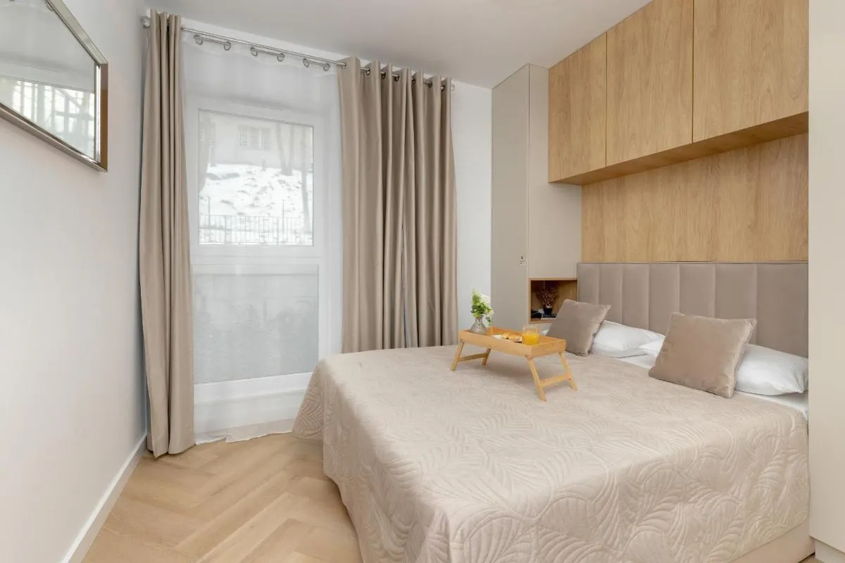 Image 1 of Bright Beige Apartment with Furnished Balcony and Parking in Gdańsk by Renters