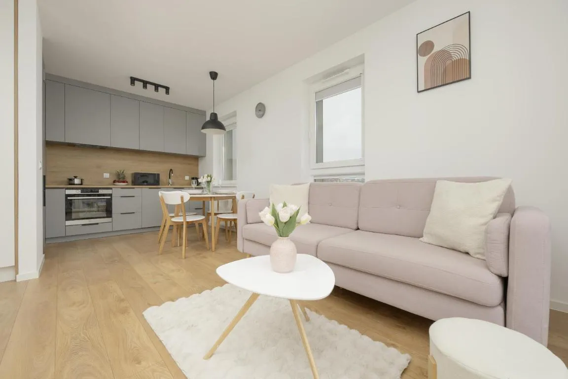 Image of Bright Pastel Apartment with Desk for Remote Work, Balcony and Parking by Renters