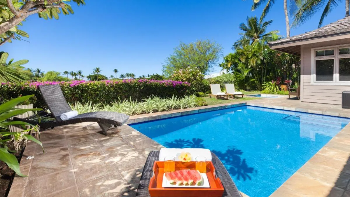 Image 6 of CORAL REEF Lush 4BR KaMilo Home with Heated Pool and Guest Cottage
