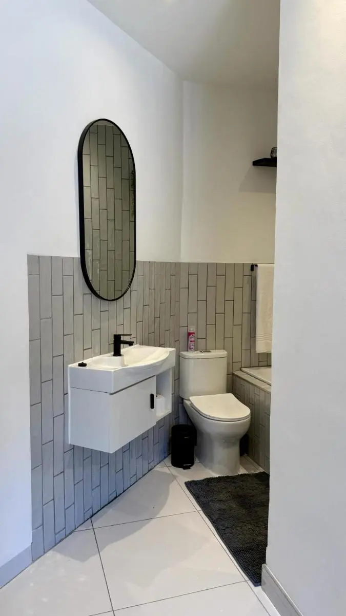 Image 6 of The Monochrome Apartment 209 – Urban Chic Escape – Open Plan Bathroom with Bathtub