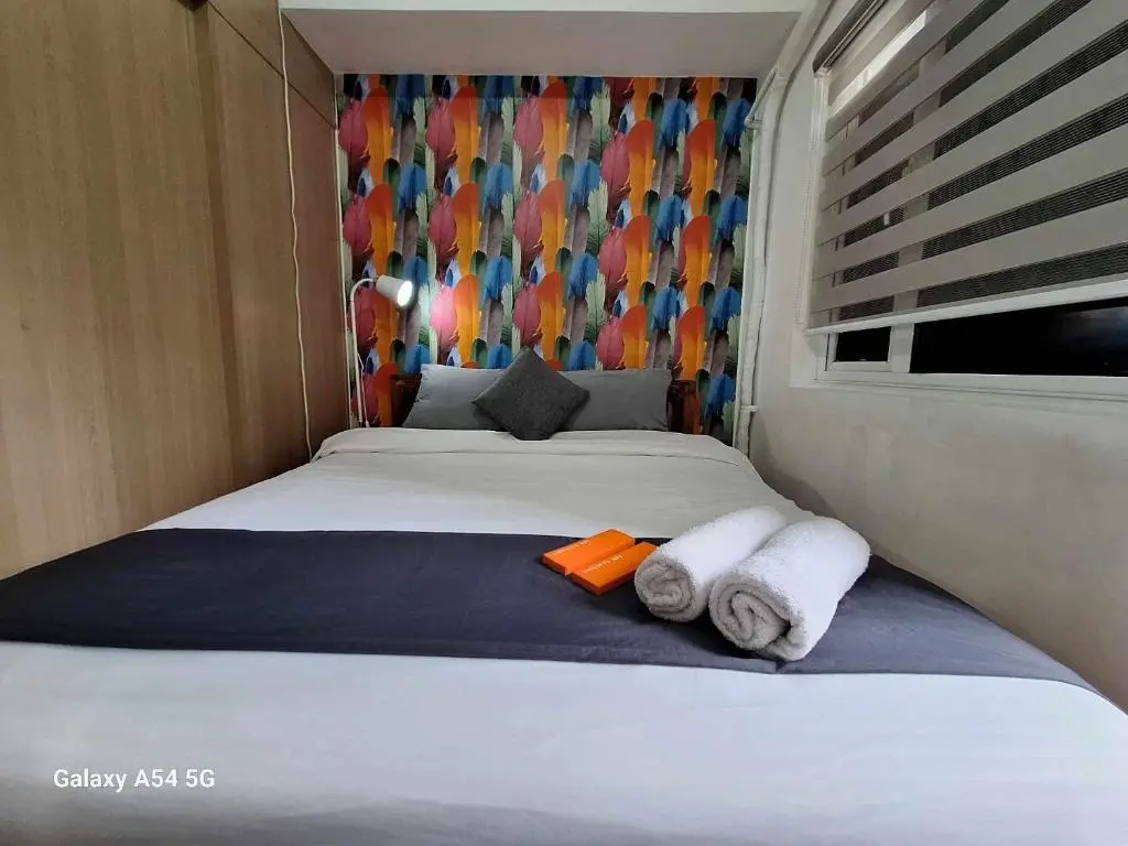 Image of 1 Bedroom with Balcony Pool View and WiFi in Grace Residences
