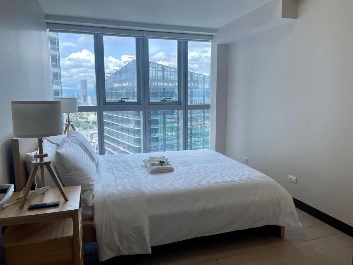 Image 1 of Bright 2-bedroom condo with pool in BGC Uptown