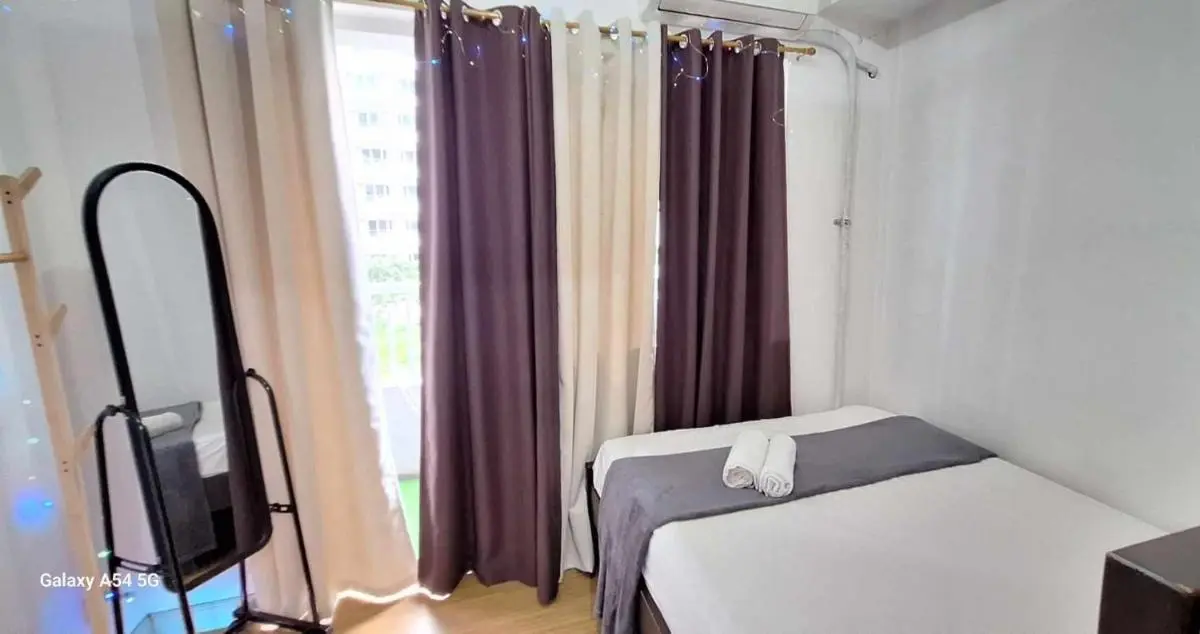 Image 1 of Bright and Cozy 1 Bedroom with Balcony Pool View and WiFi in Grace Residences
