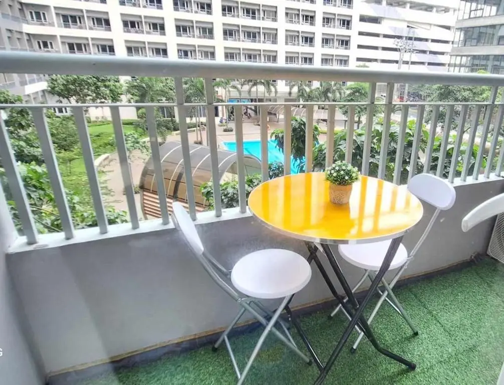 Image of Bright and Cozy 1 Bedroom with Balcony Pool View and WiFi in Grace Residences