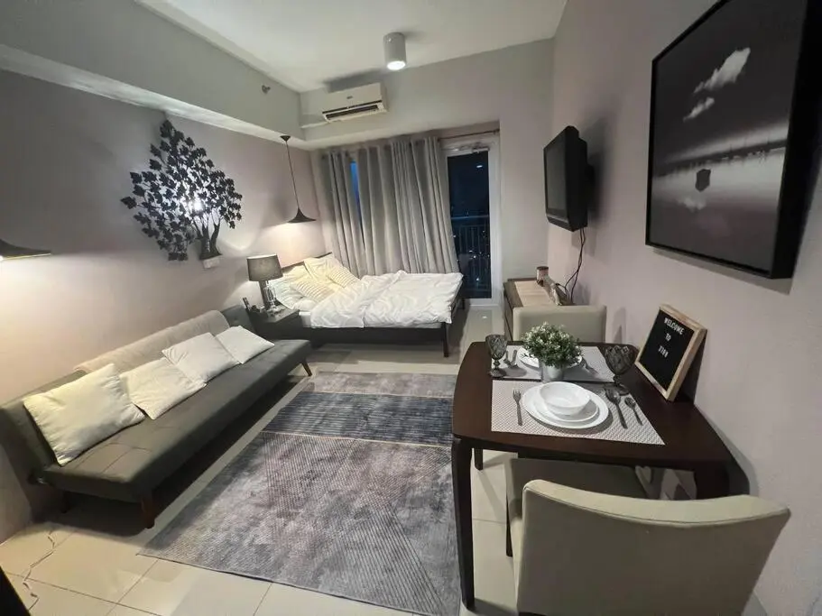 Image of Cozy Makati Condo Getaway with balcony