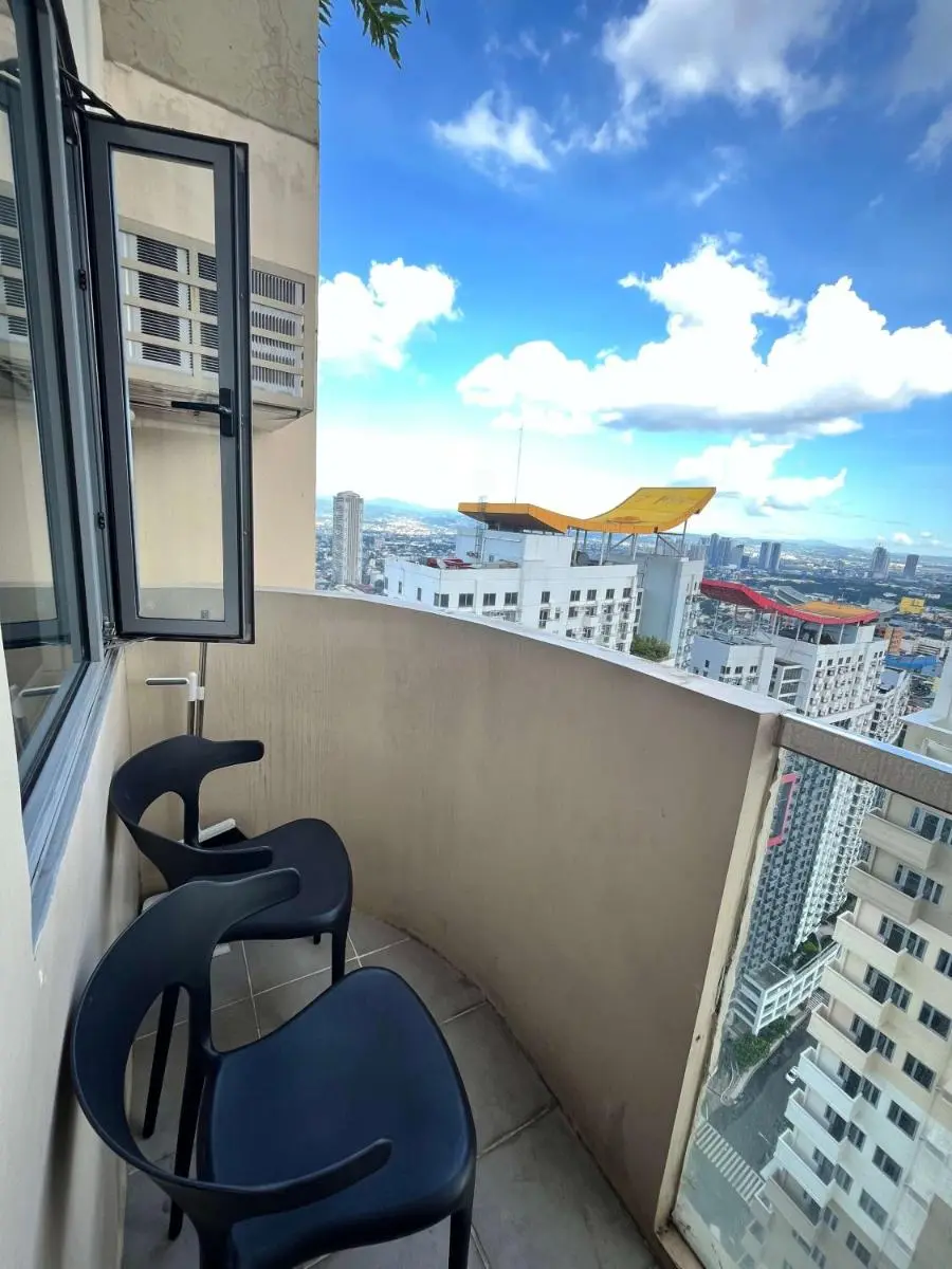 Image 3 of Cubao Manhattan Plaza Residential Condo T139G – HUGE Studio with Pool, Kitchen & Balcony, Walk Distance to Araneta Coliseum LRT MRT Malls in Cubao Quezon City – Staycations by SMS
