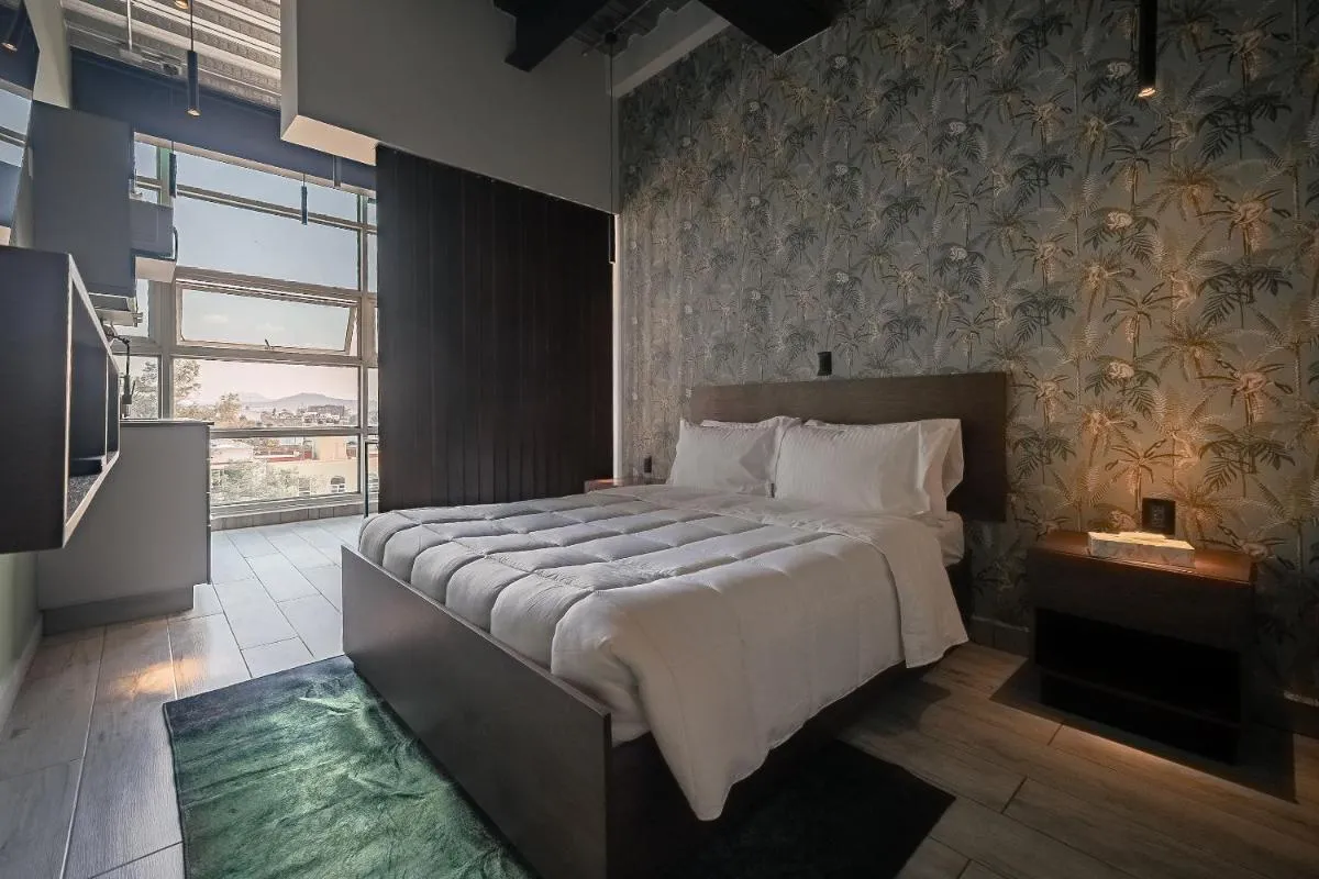 Image 1 of The Jungle Loft Tropical Comfort in a Centric Location with Kitchen