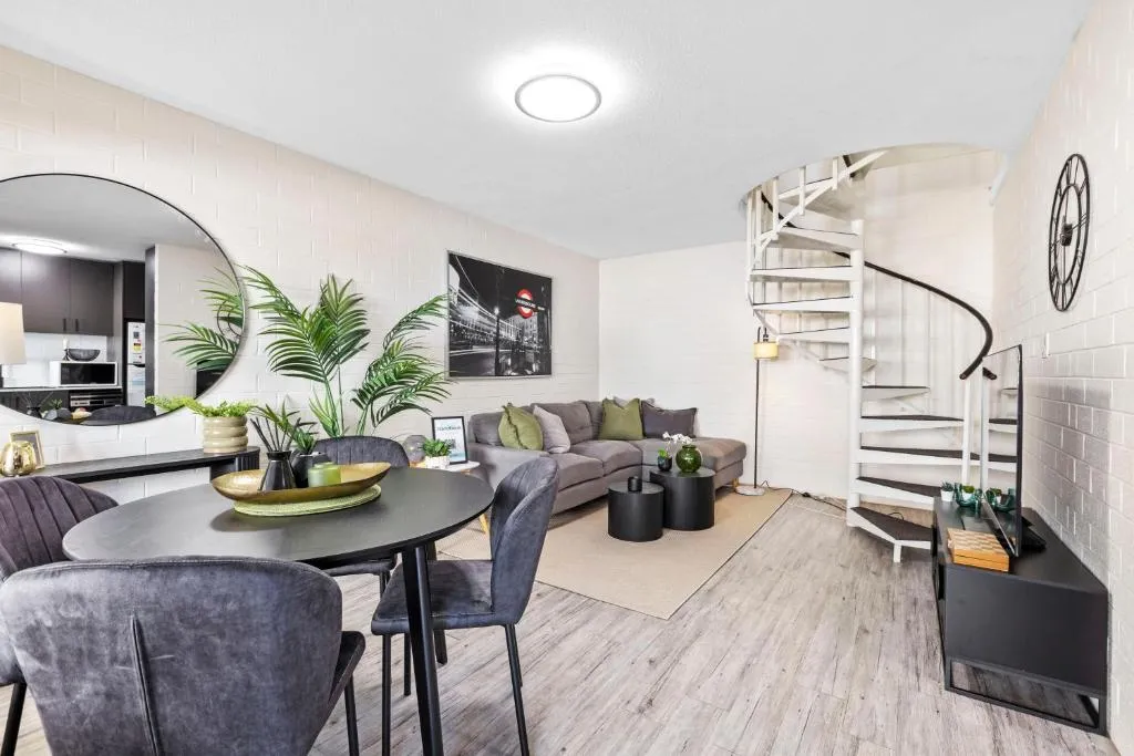 Trendy townhouse on lakes edge with lush parks
