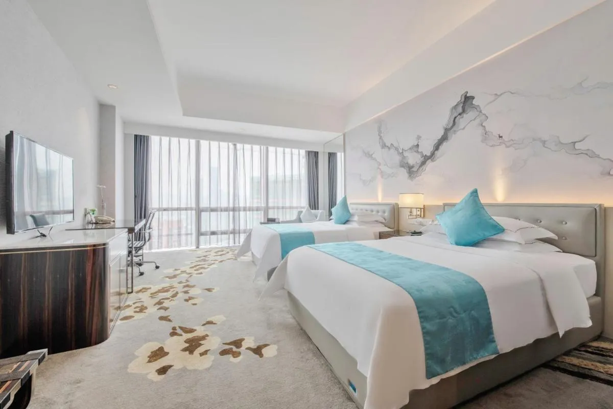 Image 1 of Huaqiang Plaza Hotel Shenzhen, Enjoy Complimentary Mini Bar & Night Snack, Breakfast included guests also enjoy complimentary afternoon tea