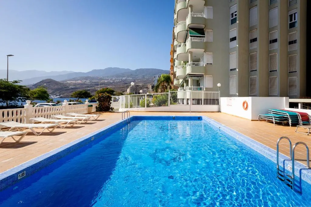 Image of Beachfront with communal swimming pool and parking