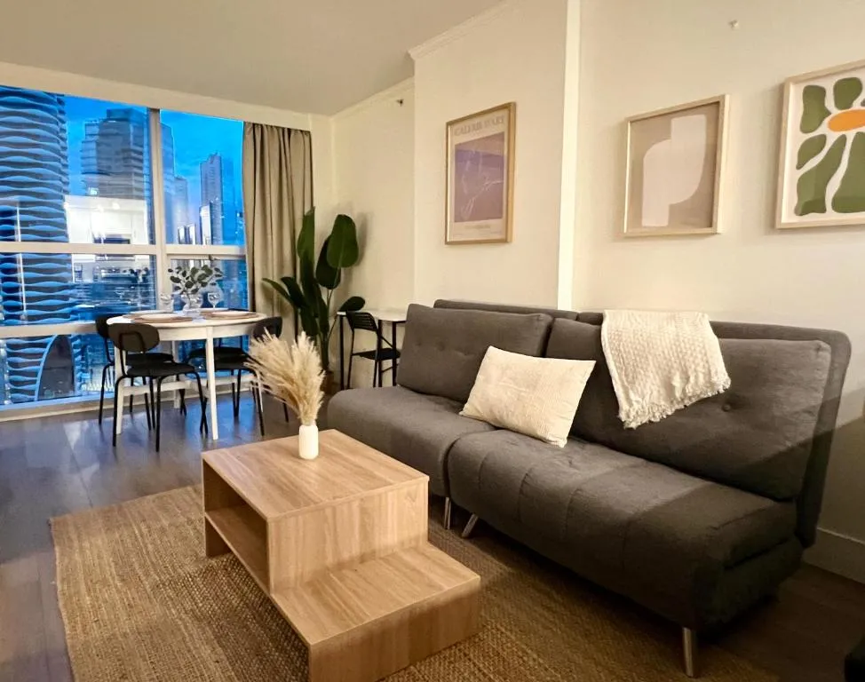 Image of Stunning Skyline Views in a Cozy and Stylish Abode