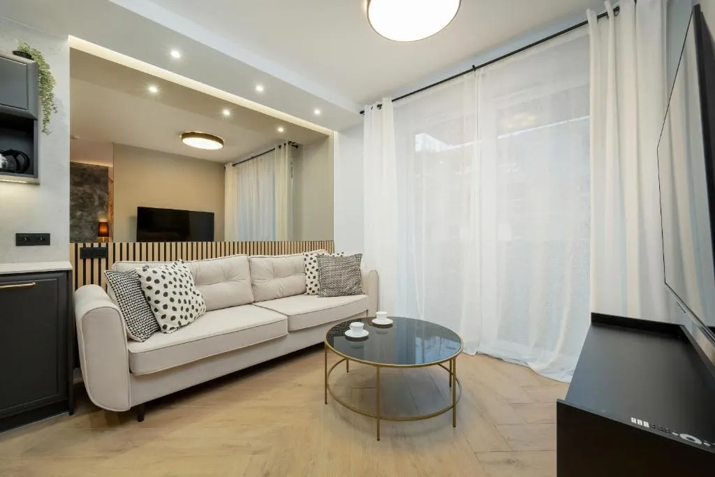 Image of Black and Beige Apartment with Balcony and Parking in Wrocław by Noclegi Renters