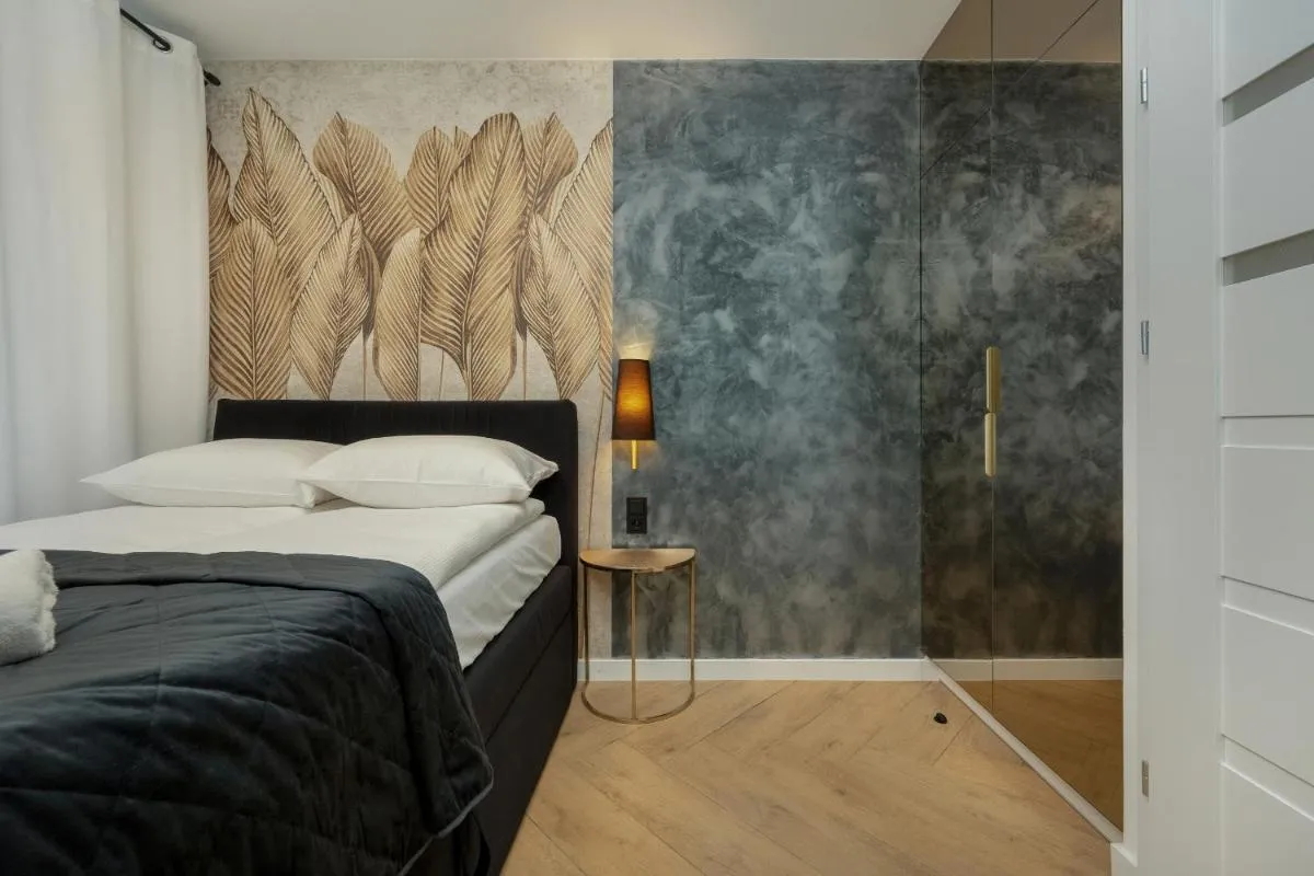 Image 1 of Black and Beige Apartment with Balcony and Parking in Wrocław by Noclegi Renters
