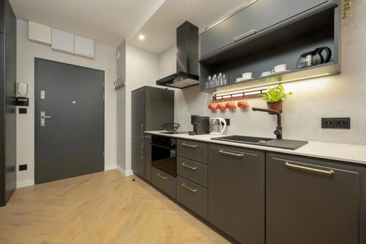 Image 2 of Black and Beige Apartment with Balcony and Parking in Wrocław by Noclegi Renters