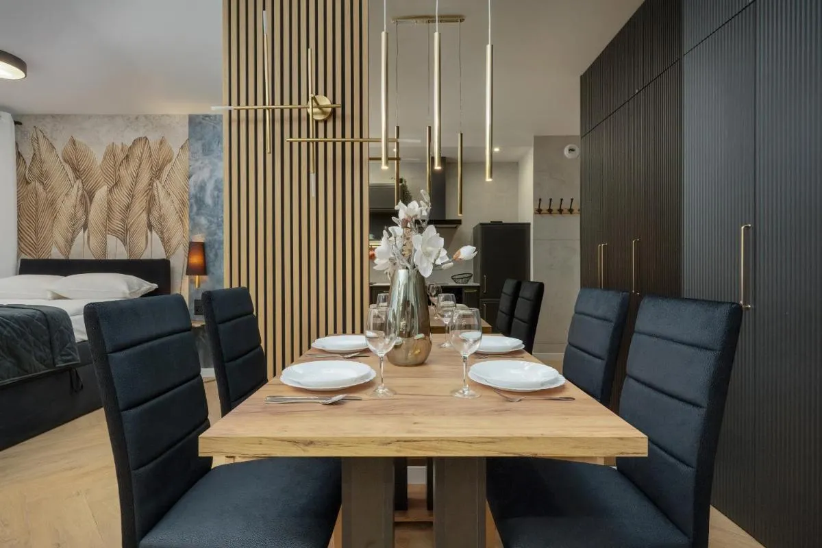 Image 4 of Black and Beige Apartment with Balcony and Parking in Wrocław by Noclegi Renters