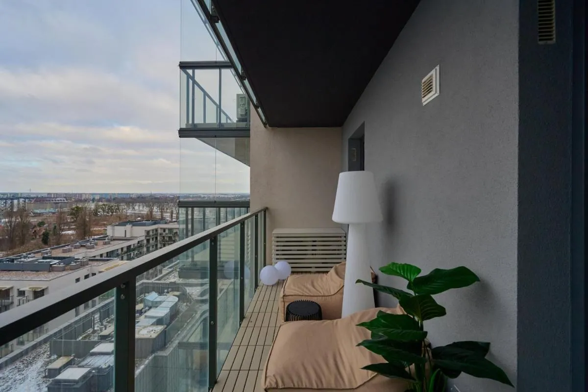 Image 3 of Luxurious 13th Floor Beige Apartment in Wrocław with Furnished Balcony by Renters Prestige